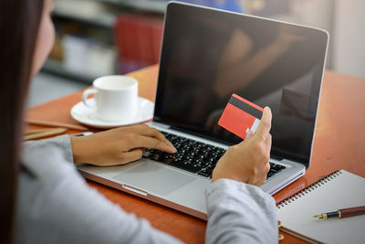 Man using laptop on table