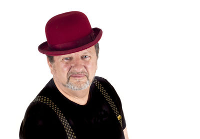 Portrait of man wearing hat against white background