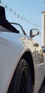 Close-up of vintage car against clear sky