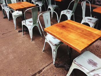 High angle view of empty chairs and table in restaurant