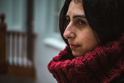 Close-up of thoughtful woman wearing warm clothing