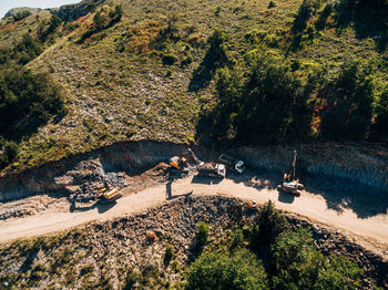 High angle view of people on road by trees