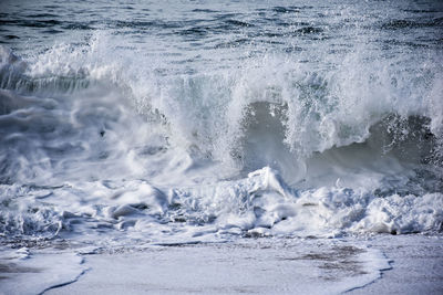 Waves splashing on shore