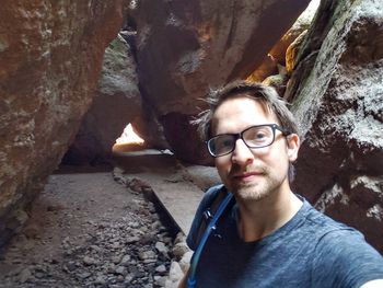 Portrait of young man in cave