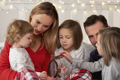 Family on bed at home