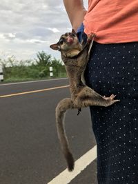 Man with umbrella on road