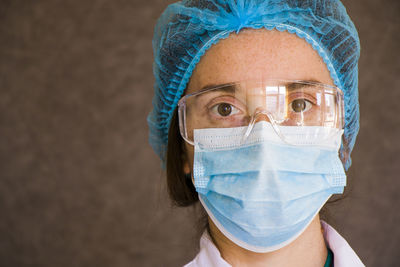 Woman doctors portrait, doctors with mask, glasses, glove and uniform. 
