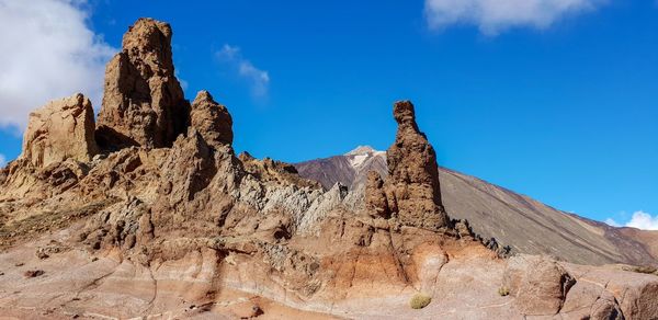 Panoramic view of rock formations against sky