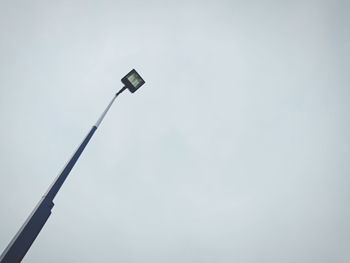 Low angle view of street light against sky