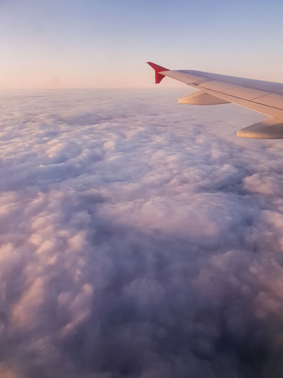 AERIAL VIEW OF CLOUDSCAPE OVER AIRPLANE