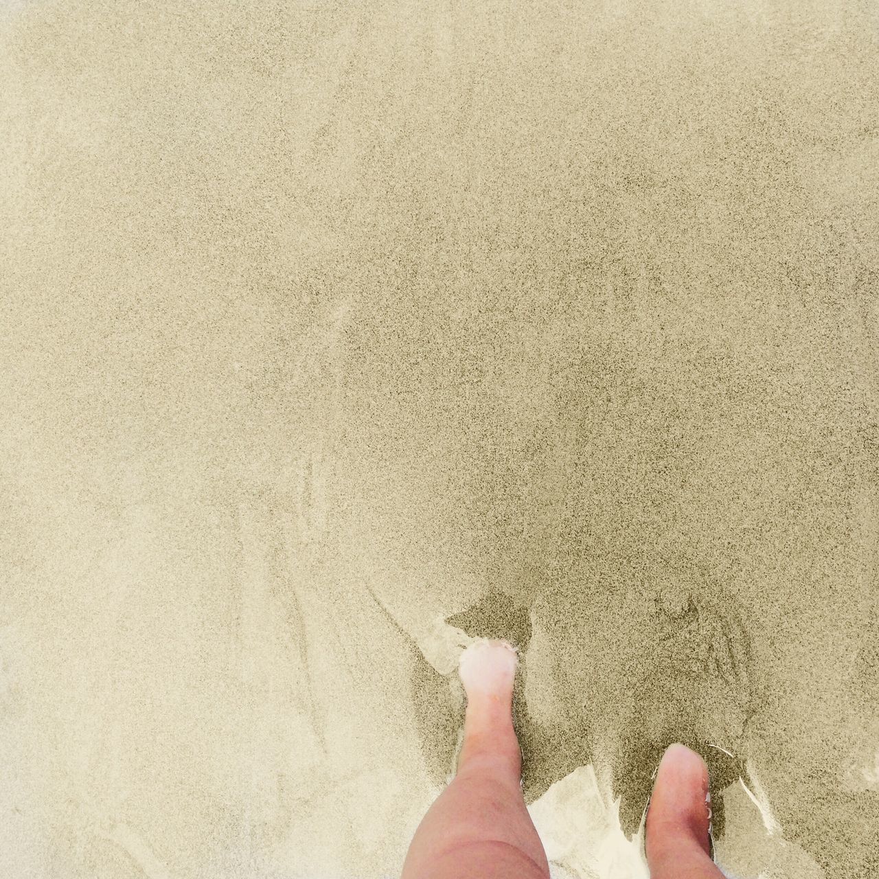 low section, person, sand, beach, standing, high angle view, vacations, human foot, personal perspective, day, nature, outdoors, summer, shore