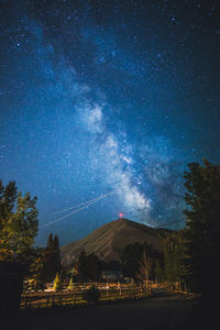 Scenic view of star field against sky at night
