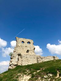 Low angle view of old building against sky