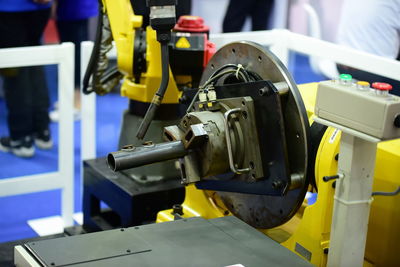 Close-up of yellow machine in industry