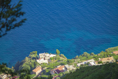 High angle view of townscape by sea