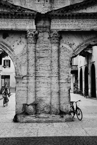 Bicycle against building in city