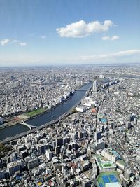 High angle view of buildings in city against sky