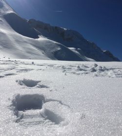 Scenic view of snow mountains against sky
