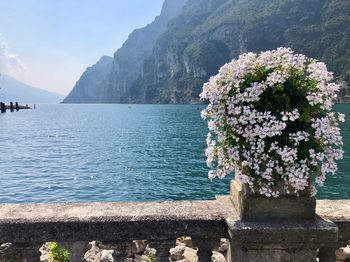 Scenic view of sea and mountains against sky