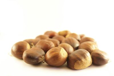 Close-up of eggs against white background