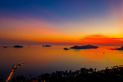 Scenic view of sea against orange sky