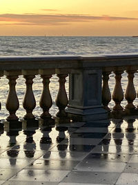 Full frame shot of chess with sea in background at sunset
