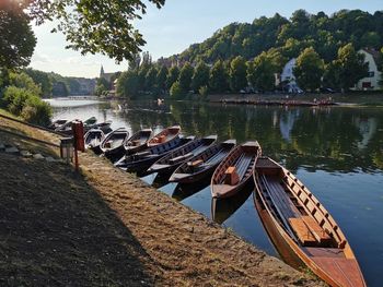 Boats moored in lake