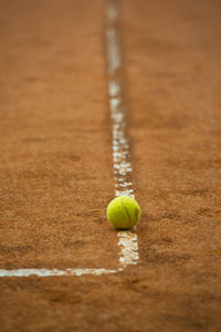 Close-up of tennis ball on playing field