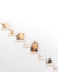 Objects on staircase against wall