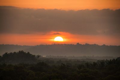 Scenic view of landscape against romantic sky during sunset