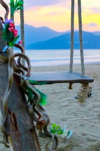 Close-up of rope on boat against sea