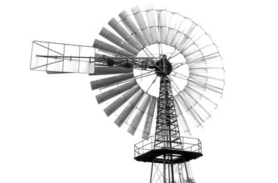 Low angle view of ferris wheel against sky