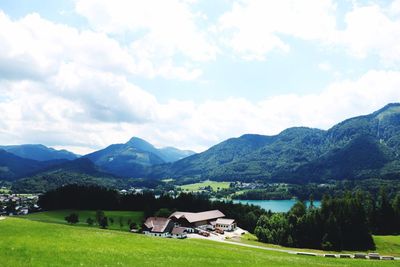 Scenic view of mountains against cloudy sky