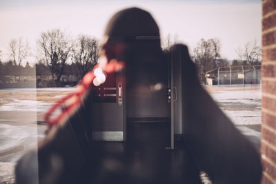 Open door seen through window