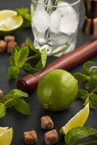 Close-up of fruits and leaves on table