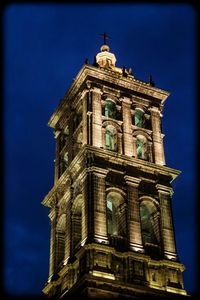 Low angle view of church against blue sky