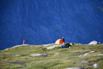 People camping against mountain