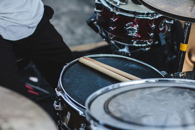 Close-up of man playing drums