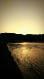 View of calm sea at sunset