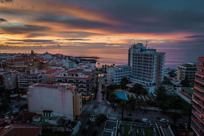 High angle view of buildings against sky during sunset