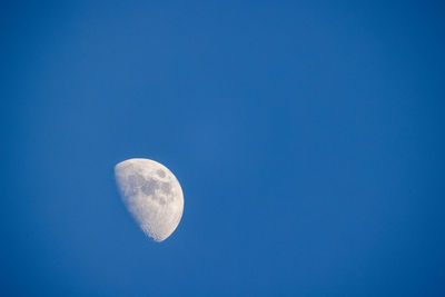 Low angle view of heart shape against clear blue sky