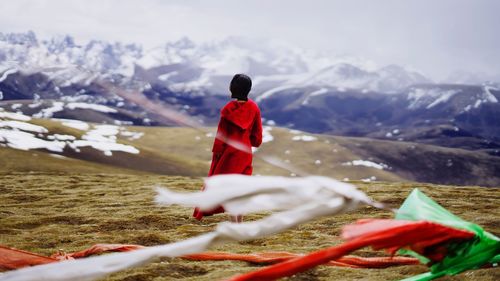 Woman on snowcapped mountain