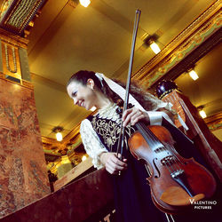 Low angle view portrait of young woman playing at home