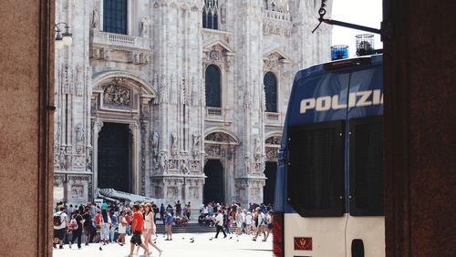 Group of people in front of historical building