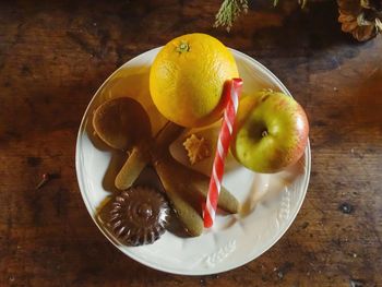 High angle view of fruits in plate on table