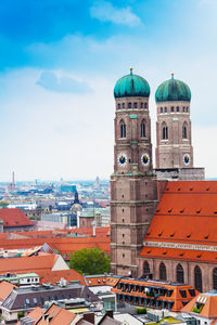 View of buildings in city against sky