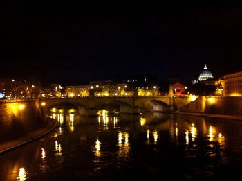 Bridge over river at night