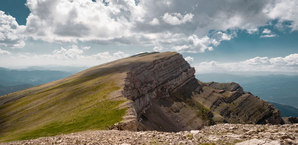 Rock formations on landscape against sky