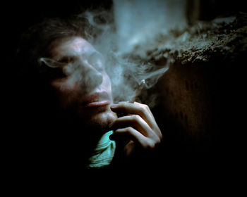 Close-up of man smoking cigarette