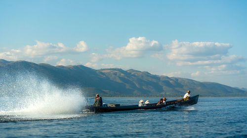 People on boat sailing in sea